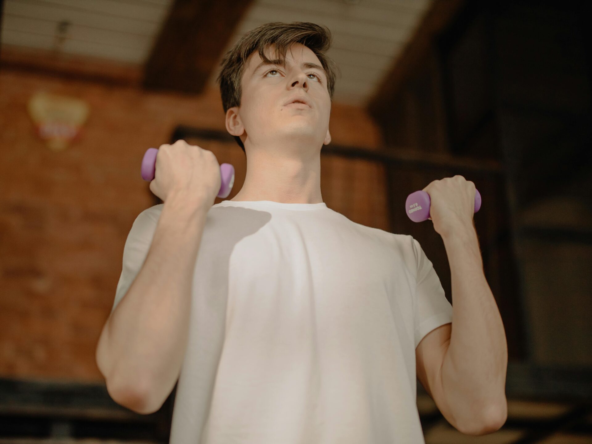 mid 20's man working out in bedroom