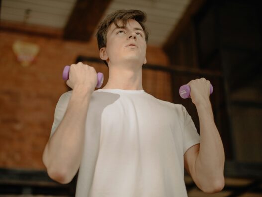 mid 20's man working out in bedroom